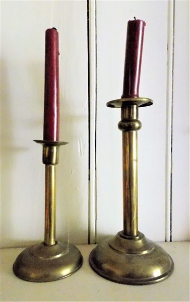 2 Weighted Brass Candle Sticks Measuring 9 1/4" and 7 1/4"