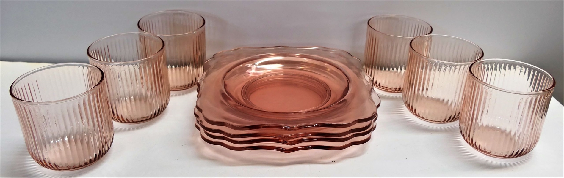 4 Pink Depression Square Plates 7 1/2" Across and 6 Pink Ribbed Anchor Hocking Tumblers 3 1/8" tall 