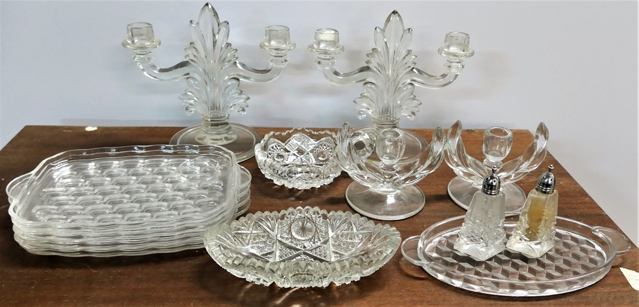 Lot of Glassware including Candle Holders, Snack Plates, and Salt and Peppers - Larges Candle Sticks Measure 8 1/2" tall 