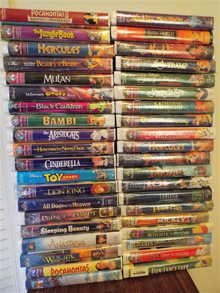 40 Brand New in Plastic Disney VHS Tapes including "The Little Mermaid" "Aladdin" "Pocahontas" "101 Dalmations" "Tarzan" "Fantasia" "Bambi" and More