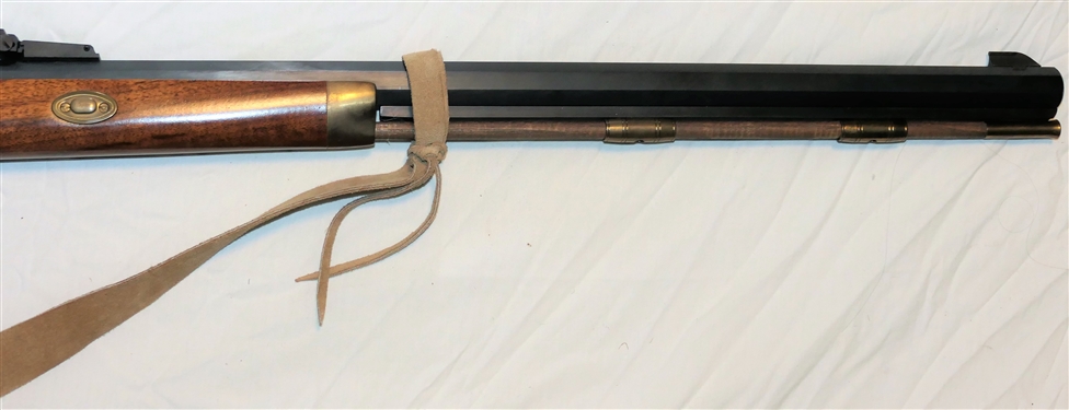 Thompson Center Arms . 45 Caliber Black Powder Long Rifle - Double Trigger with Brass Patch Box and Leather Sling Strap