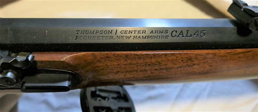 Thompson Center Arms . 45 Caliber Black Powder Long Rifle - Double Trigger with Brass Patch Box and Leather Sling Strap