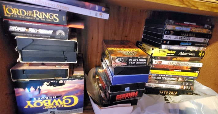 Lot of DVD and VHS Movies including JAWS, Death Tunnel, Lord of the Rings, and Classic Cowboy