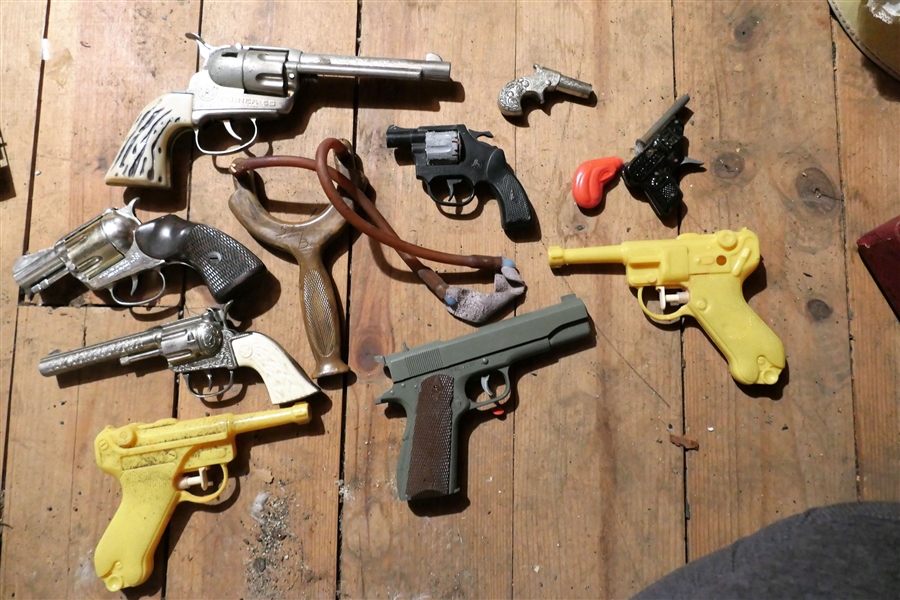 Lot of Toy Cap Guns Mattel Fanner, Mattel Snub Nose .38, Wasp, Squirt Guns, and Sling Shot