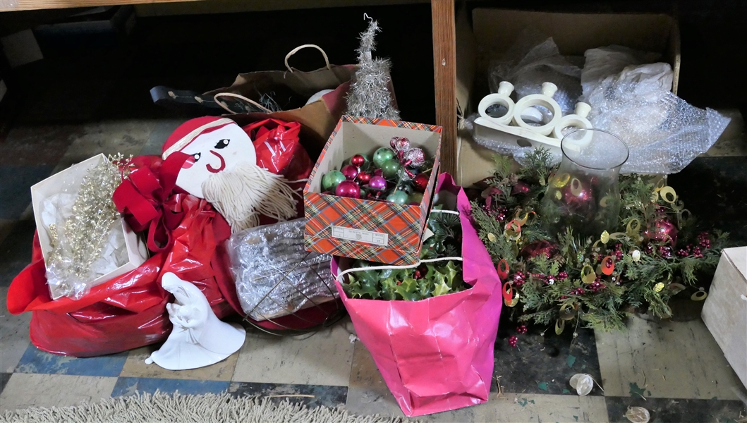 Lot of Christmas Items Including Bows, Candle Arrangement, Faux Greenery, and Ceramic Candle Holders and Figure
