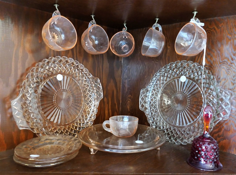 13 Pieces of Depression and Colored Glass including Heisey Punch Cups, Wexford Pink and Clear Cake Plates, Pink Footed Cake Stand, and Red Hobnail Bell 