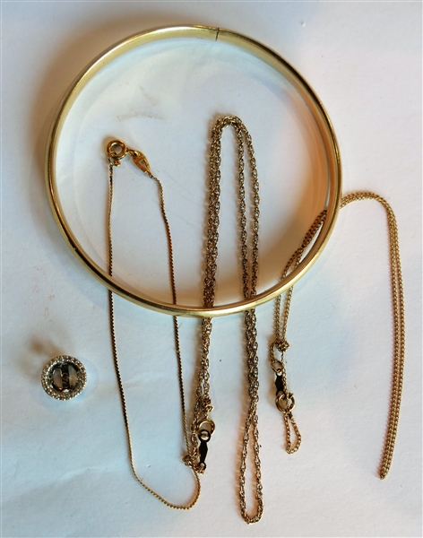 Lot of Gold including Ring 14kt Gold Bangle Bracelet- Broken, 14kt and Diamond Earring Enhancer, Tiny 14kt Gold Bracelet, 14kt Yellow Gold Necklace, and 14kt Yellow Gold Necklace - Necklaces are...