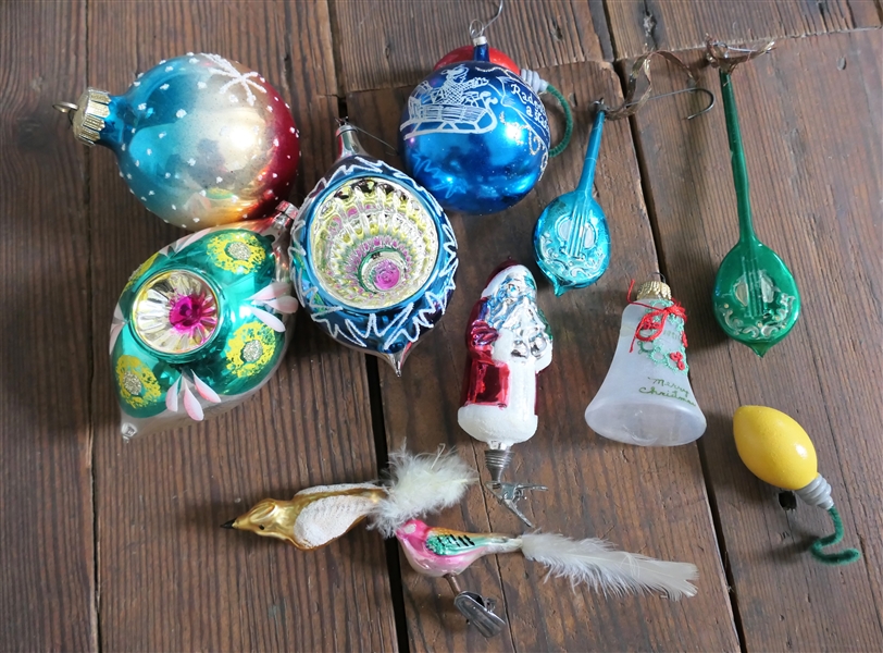 Group of Antique Christmas Ornaments including Balls, Santa, Instruments, and Birds 