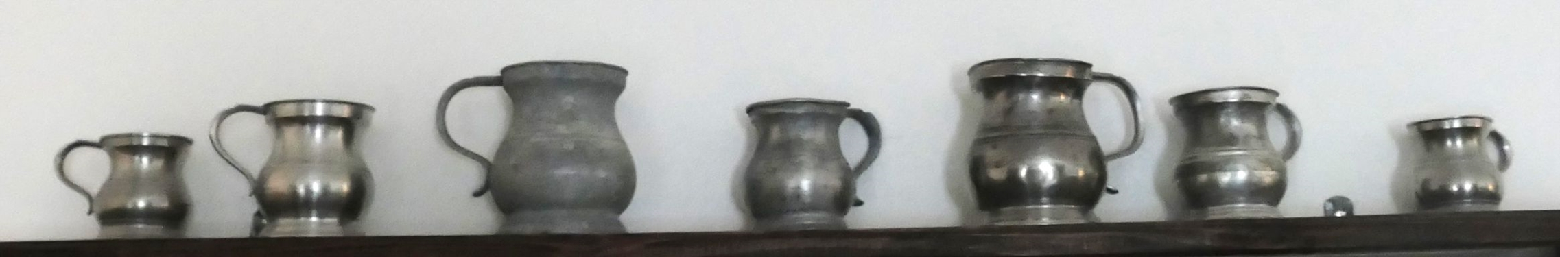 7 Small Pewter Pitchers - Largest Measures 4 tall 