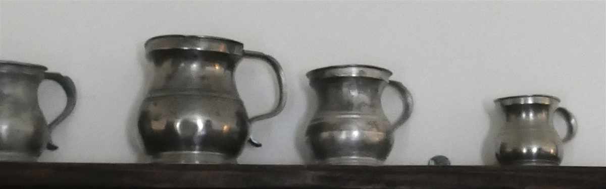 7 Small Pewter Pitchers - Largest Measures 4 tall 