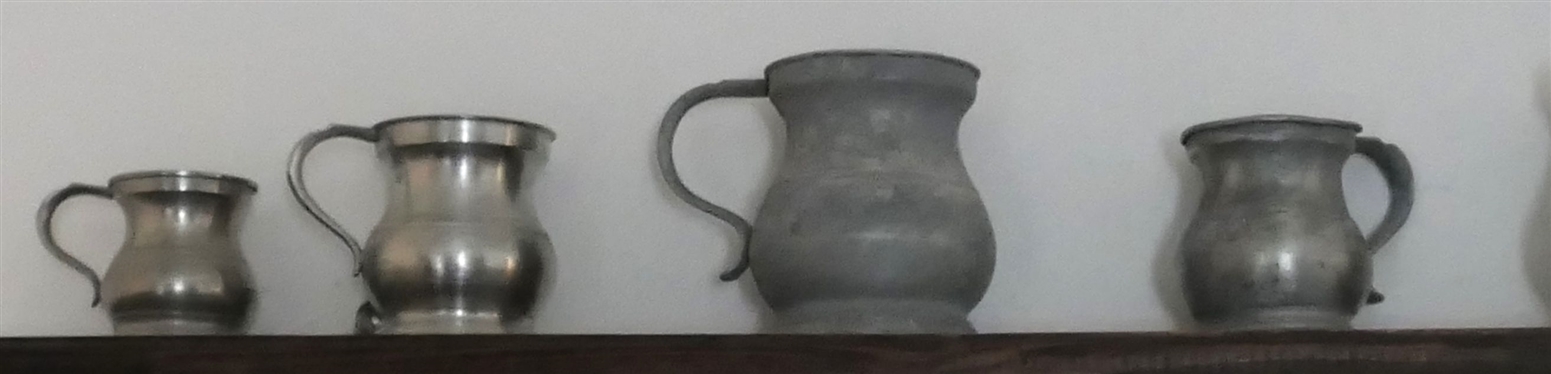 7 Small Pewter Pitchers - Largest Measures 4 tall 