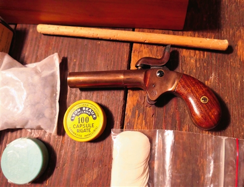 Mississippi Derringer - Black Powder Box Lock .41 Caliber Pistol in Wood Box with an Eagle on Top also Including Powder Flask, Caps, and Balls - 