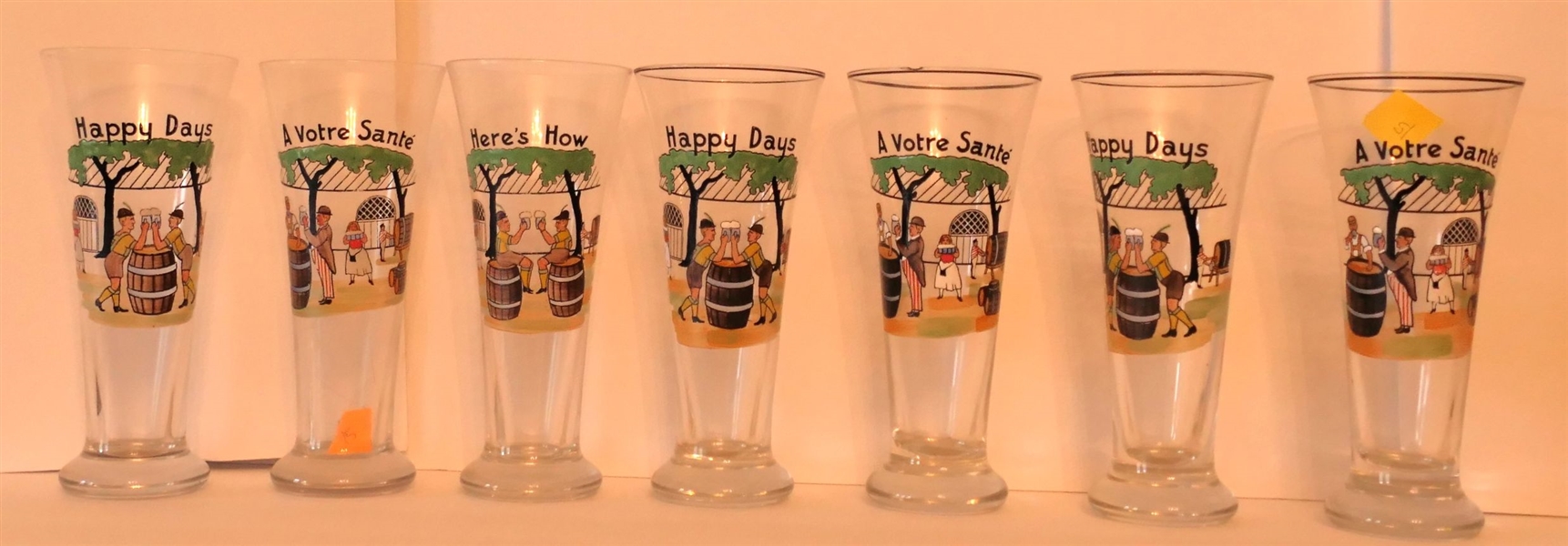 7 Beer Glasses with "Heres How, Happy Days, and A Votre Sante" - Each Measures 7 1/2"