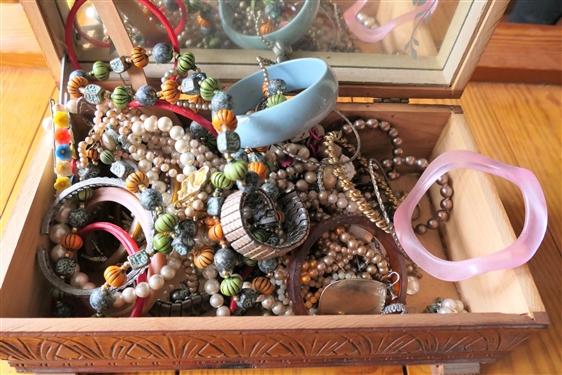 Lot of Costume Jewelry in Wood Box with Mirrored Lid - Box Measures 4 tall 11 by 6 - Jewelry Includes Beaded Necklaces, Faux Pearls, Bangle Bracelets, and Watches