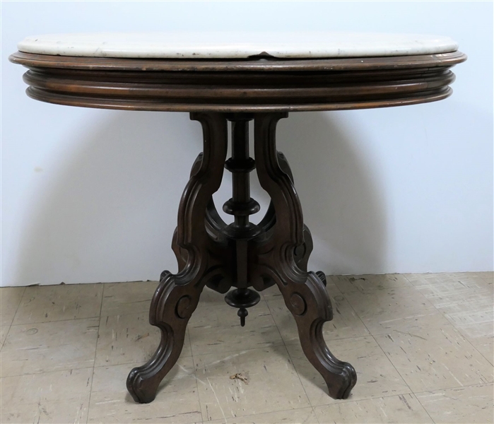 Walnut Victorian Marble Top Table - Oval White Marble Top - Measures 29" Tall 35" by 25" - Marble is Chipped Under the Outer Edge