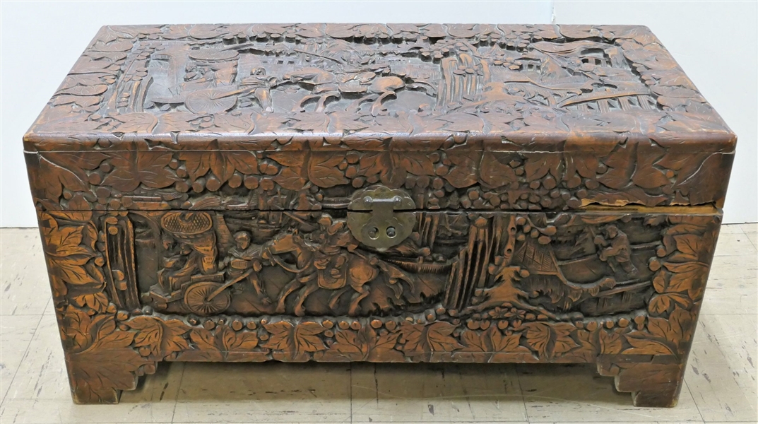 Heavily Carved Asian Mahogany Scenic Chest Depicting Warriors, Villages and Leaf Carvings Dovetailed Case - Brass Hardware - Front Right Corner of Lid Has Repair -  Measuring 15 1/4" Tall 31" by 14...