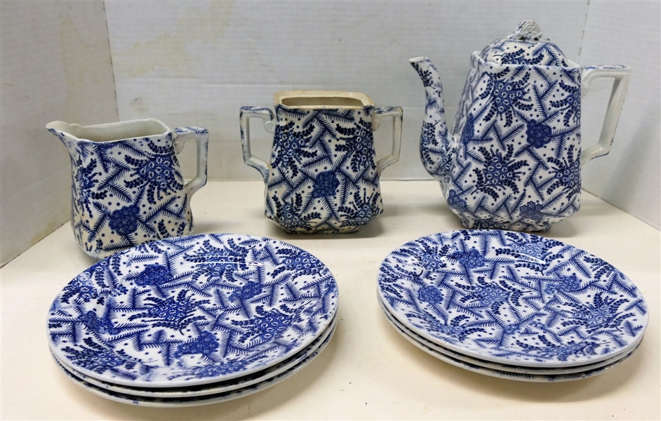 9 Pieces of "Heriff" by Wallis Gimson & Co. Blue and White Transferware including Tea Pot, Cream Sugar, and 6 Plates - Sugar is Missing Lid and Has Repair, 8 1/2" Tea Pot - Lid Has Crack, Plates...