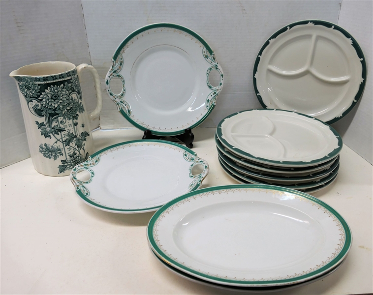 11 Pieces of Green and White China including Green Floral Transferware 8" Pitcher, 6 Syracuse China Grill Plates, 2 10" Handled Plates, and 2 11" Oval Platters