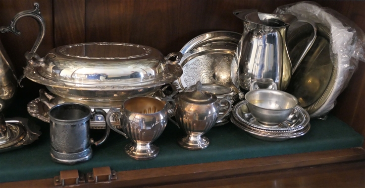 Shelf Lot of Silverplate Items - Pitchers, Tea Pots, Gravy Boats, Coasters, Covered Dishes, Butter Dish, Basket, and Coasters