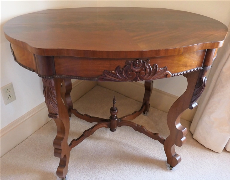 Flame Mahogany Victorian Turtle Top Parlor Table with Scrolled Legs - Rose Carved Apron Arched Stretcher Base - Measures 29" Tall 38" by 26 1/2"