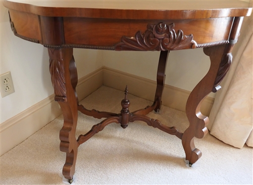 Flame Mahogany Victorian Turtle Top Parlor Table with Scrolled Legs - Rose Carved Apron Arched Stretcher Base - Measures 29 Tall 38 by 26 1/2