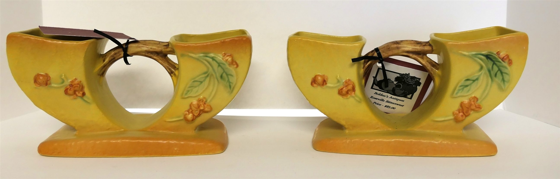 Pair of Roseville Bittersweet Vases  - Number 858 - Measuring 4" Tall 8 1/2" by 3"
