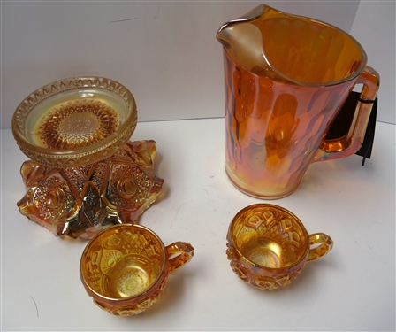 4 Pieces of Marigold Carnival Glass including 8 Pitcher, Punch Bowl Base, and 2 Punch Cups