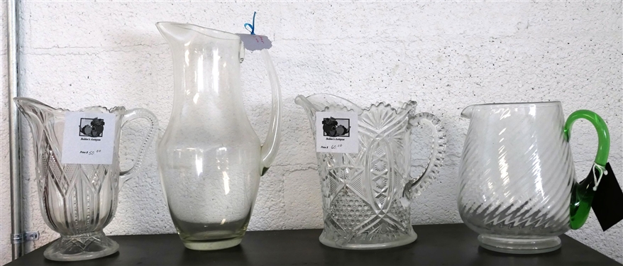 4 Clear Glass Pitchers - 2 Early American Press Glass, Clear Swirl with Applied Green Handle, and Tall Clear Pitcher - Tallest Measures 12 tall - Green Handle Measures 7 Tall 