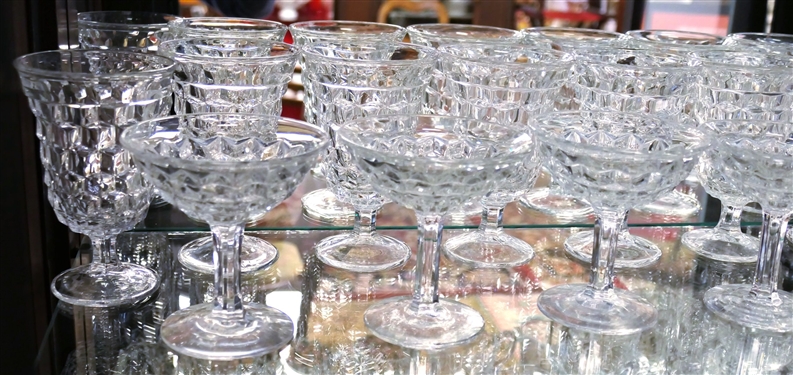 2 Shelves of Clear Glassware including American Fostoria Champagnes, American Fostoria Iced Teas, American Fostoria Cream & Sugars, Elegant Etched Glass Pieces, and Press Glass Cream and Sugar