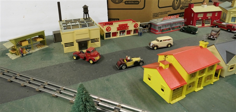 Plastic Train Town Pieces including Fire Department, Churches, Supermarket, Houses, Shed, Newsstand, Coca Cola Diner, Telephone Booth, Mail box, and Cars, Bus, Delivery Trucks, Fire Truck, and Cars...