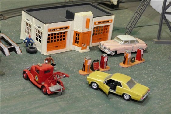 Plastic Service Station, Gas Pumps, Water Tower, Tall Tower, and Cars including Tow Truck - Also including Spare Tire, Vehicle Lift, and Mechanic Figure