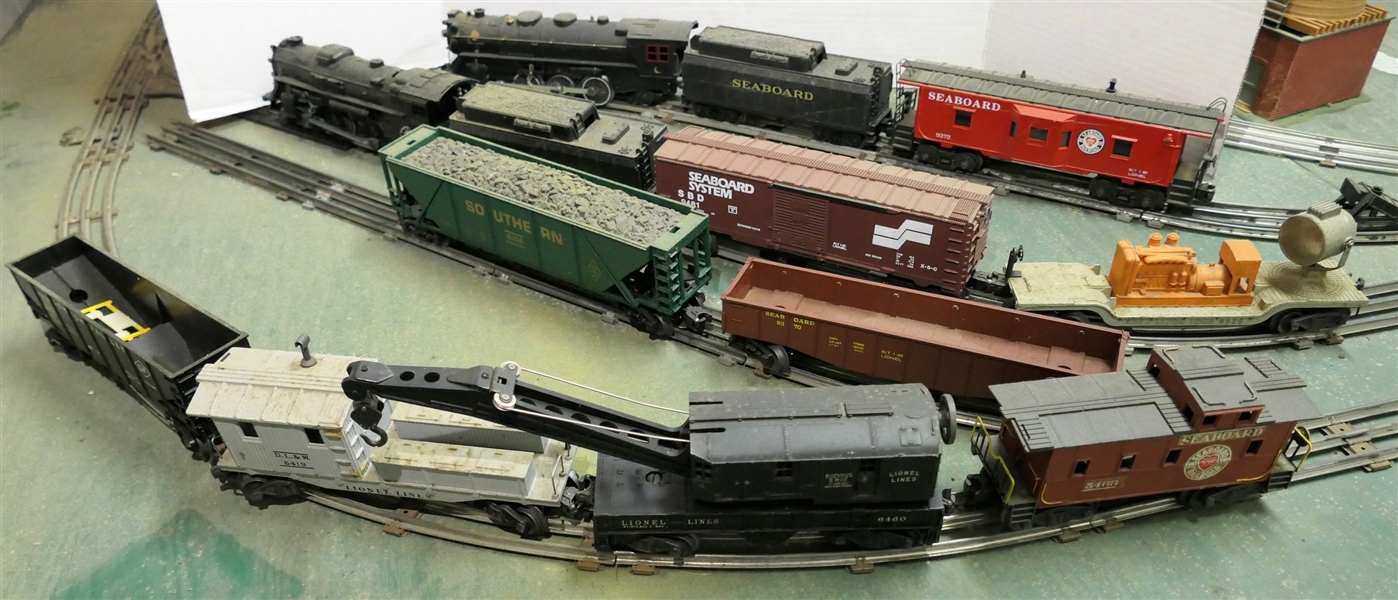 13 Lionel Train Pieces - Seaboard Engine and Coal Car, Seaboard 9372 Car, 8204 Engine, Chesapeake & Ohio Coal Car, Seaboard 9481 Car, Searchlight, Southern 6104 Car, Seaboard 9370, Lehigh Valley...