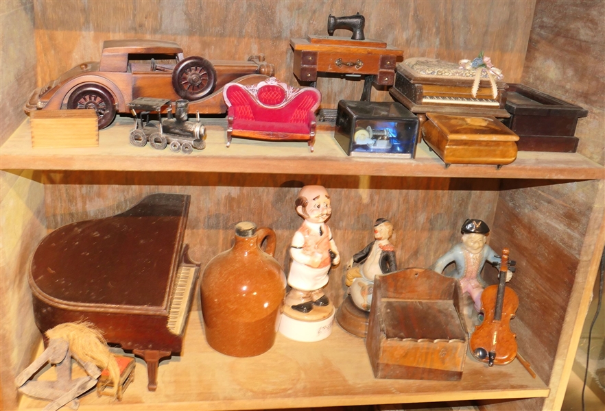 Contents of 2 Shelves including Trinket Boxes, Music Boxes, Model Car, Piano, Figural Decanters, and Jug