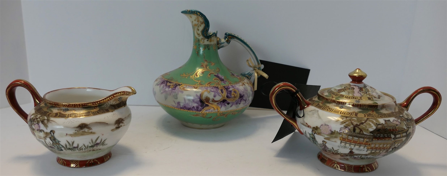 3 Pieces of Hand Painted Porcelain - Nippon Cream and Sugar Dishes and Green and Purple Floral Pitcher  - Pitcher Measures 6 1/2" tall 