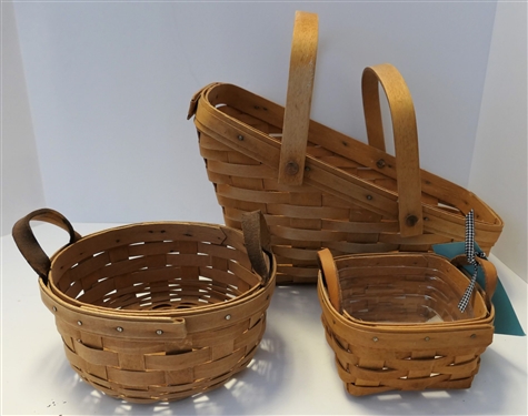 3 Longaberger Baskets  Smallest with Plastic Liner and Leather Handles - Round with Leather Handles, and Larger Angled - Largest Measures 8 tall 13 by 8