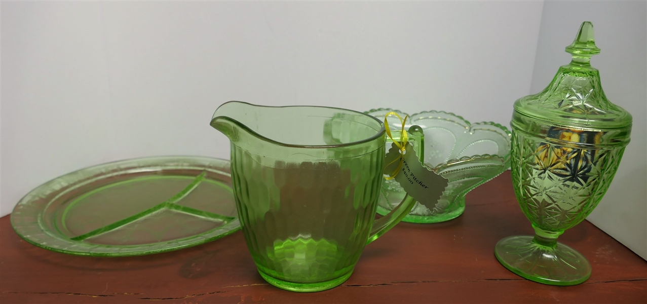 4 Pieces of Green Depression Glass including Grill Plate, Candy Jar, Pitcher, and Footed Bowl - Grill Plate Measures 10 1/2" Across