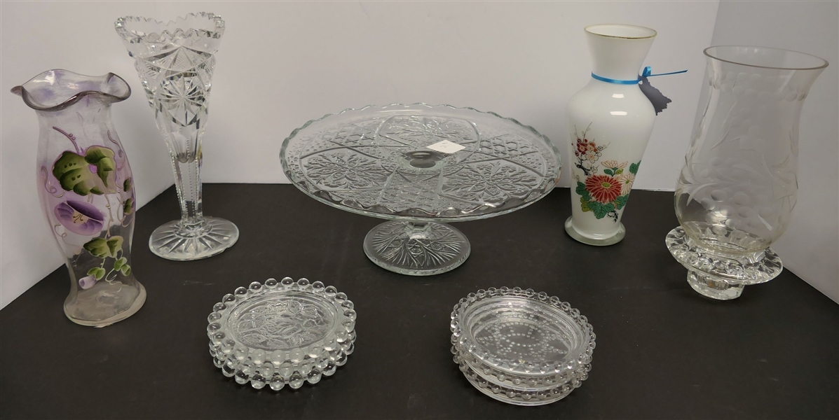 11 Pieces of Glassware including 8" Hand Painted White Glass Vase, 7" Hand Painted Amethyst Vase, Cake Stand, and Coasters- Cut Glass Vase Has Many Chips
