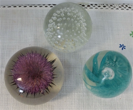 3 Paperweights - Clear Lucite with Thistle Flower, Blue Flower, and Clear with Bubbles - Oval Measures 3 1/2 Tall 