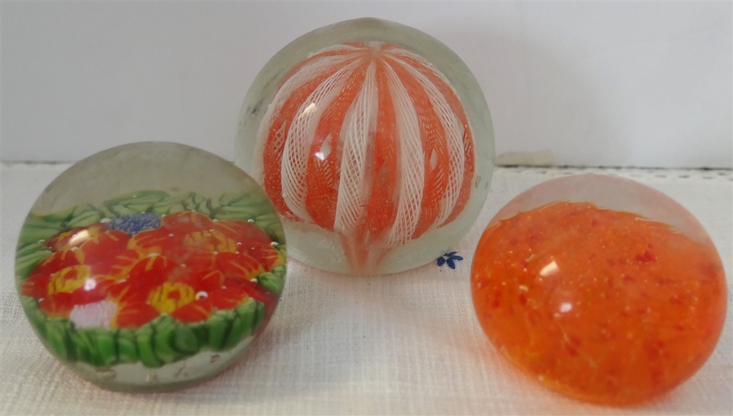 3 Art Glass Paper Weights - Orange and White, Red and Green with Flowers, and Orange with Dots inside - Orange and White Measures 3 1/2" Tall 