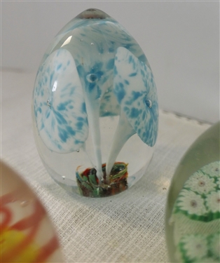 3 Art Glass Paper Weights Oval with Blue and White Flowers, Green and White Flowers, and Yellow and Orange Swirl - Oval Shaped Measures 3 1/4 Tall 