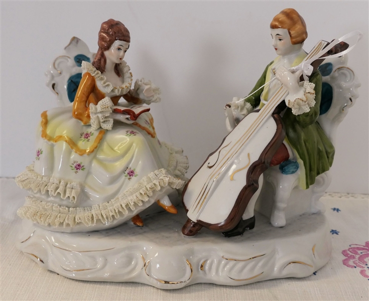 Porcelain Musician Figure with Porcelain Lace Skirt, Cuffs, and Collar  - Measures 8 3/4" tall 10" Long by 6" Across 