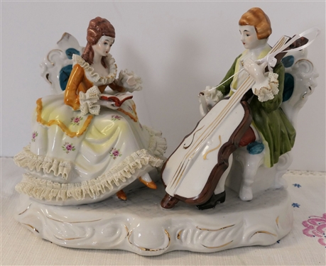 Porcelain Musician Figure with Porcelain Lace Skirt, Cuffs, and Collar  - Measures 8 3/4 tall 10 Long by 6 Across 