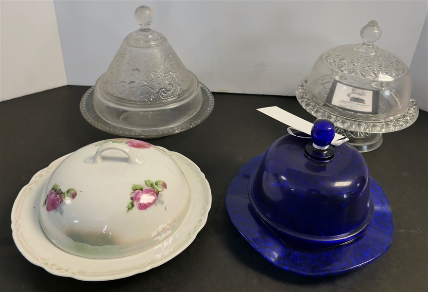 4 Butter Dishes - Pink Floral China, Cobalt Blue with Daisy and Button Bottom,  Clear Cone Shaped with Grecian Faces - Has Small Chip on Bottom, and Other Clear 