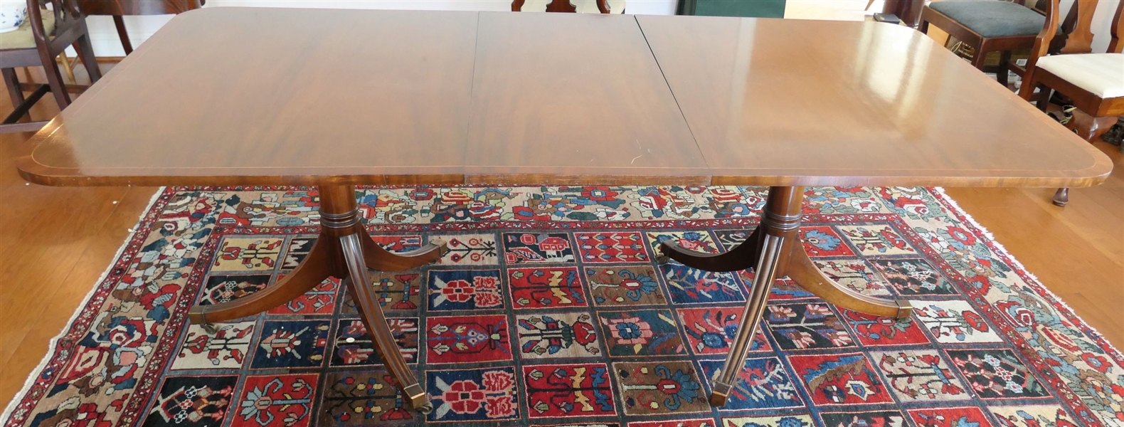 Mahogany Tibbenham of Ipswich England Double Pedestal Dining Table with 3 Leaves - Pictured with 1 Inserted - Brass Tipped Feet - Table Measures 66 Long With out Leaf 44" across - 29 12" Tall -...