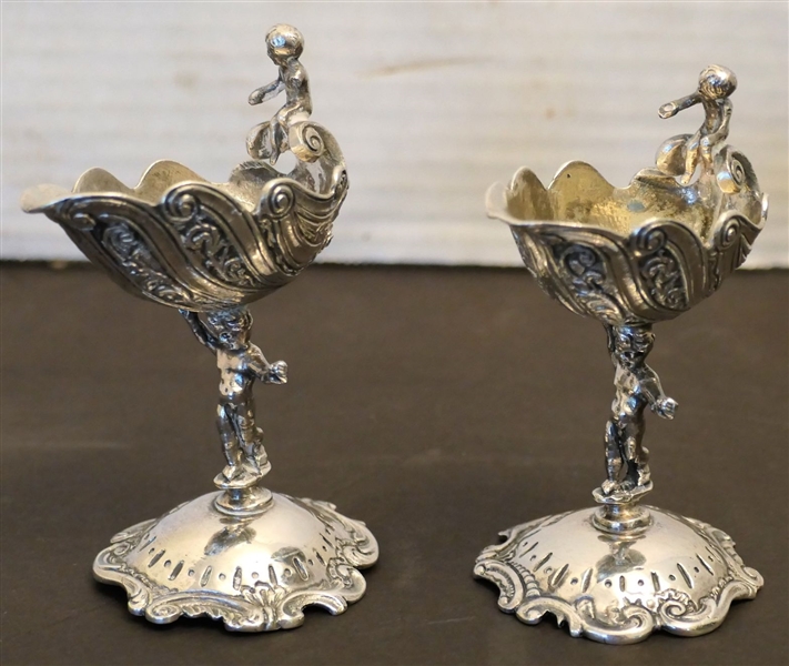 2 Hallmarked Sterling Silver Cherub and Shell Salt Cellars - Measuring 3 1/2" Tall - One Is Missing an Arm 