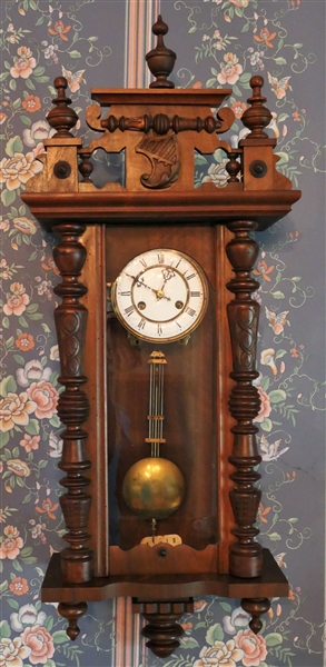 German Wall Clock with Porcelain Dial - Key and Pendulum - Measures 36" Tall 14" by 6 1/2" 