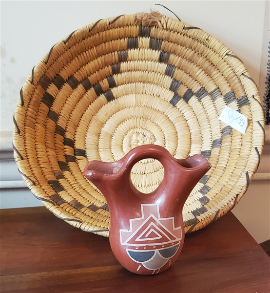 Hand Made Southwestern Indian Basket and Small Piece of Indian Pottery - Basket Measures 11" Across Pottery Measures 4 3/4" Tall - Basket Has Some Fraying To Outer Edge - See Photo