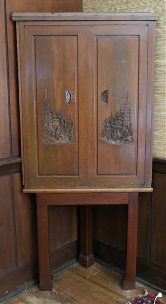 Mahogany Asian Carved Corner Cabinet on Legs - Carved Asian Scenes on Doors and Top - 2 Shelves and 1 Swing Out Drawer  - Measures 61 1/2" Tall 29" Across by 14 1/2"