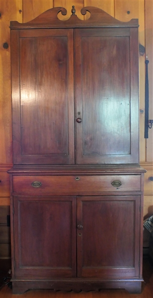 Circa 1800 Walnut 2 Piece Offset Cupboard - Broken Arch Top - Paneled Doors - Bracket Feet - Solid Ends - Dovetailed Case - Hand Dovetailed Door - Original Brass Pulls - Measures 89" Tall 41" by 18" 