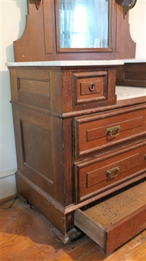Walnut Victorian Marble Top Dresser with Mirror - 2 Candle Shelves - Wood Bust At Top Crest  - Hidden Drawer At Bottom - Measures 7'5 Tall 44 by 20 - Missing 1 Wood Block on Left Bottom Corner